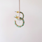 Side view of Junie Hoops on a product tag