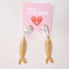 faux pearl, crystal, and metal fish earrings on a product card displayed on a white background