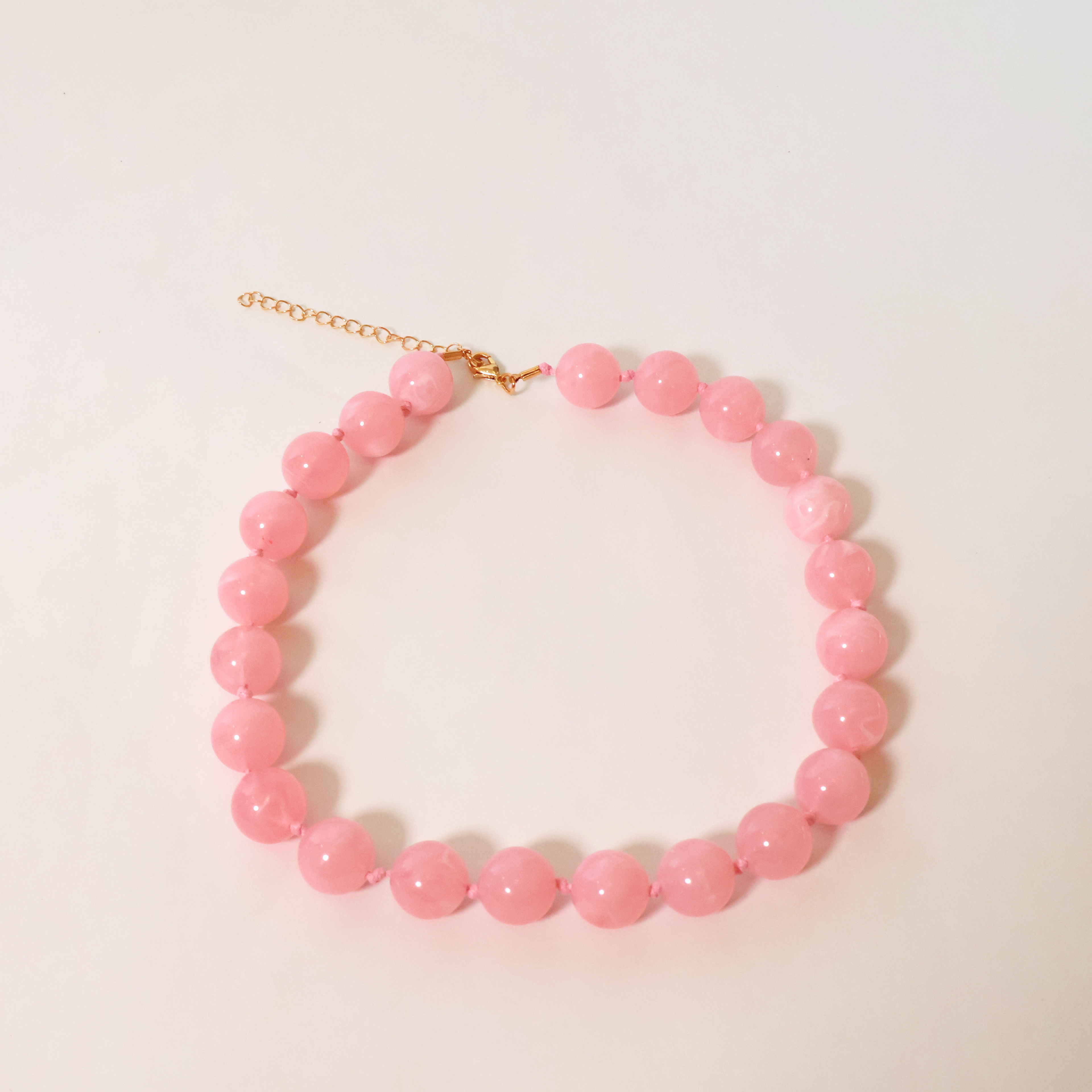 Pink Necklace on a white background