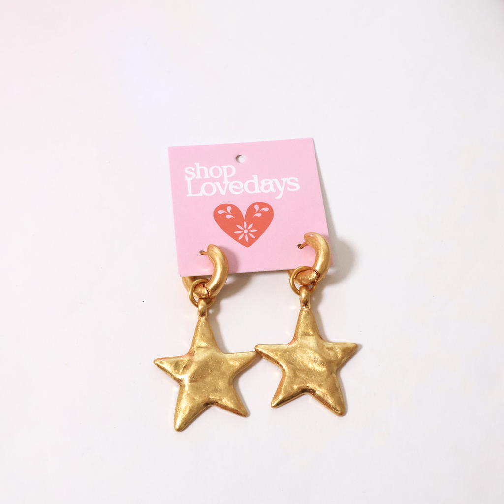 star pendant earrings on gold hoop on a product card displayed on a white background