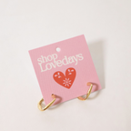 gold hoops on product tag shown on white background