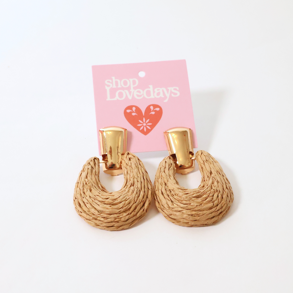 rafia and brass earrings shown on a product card displayed on a white background