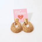 rafia and brass earrings shown on a product card displayed on a white background