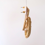 side view of earrings on a white backdrop