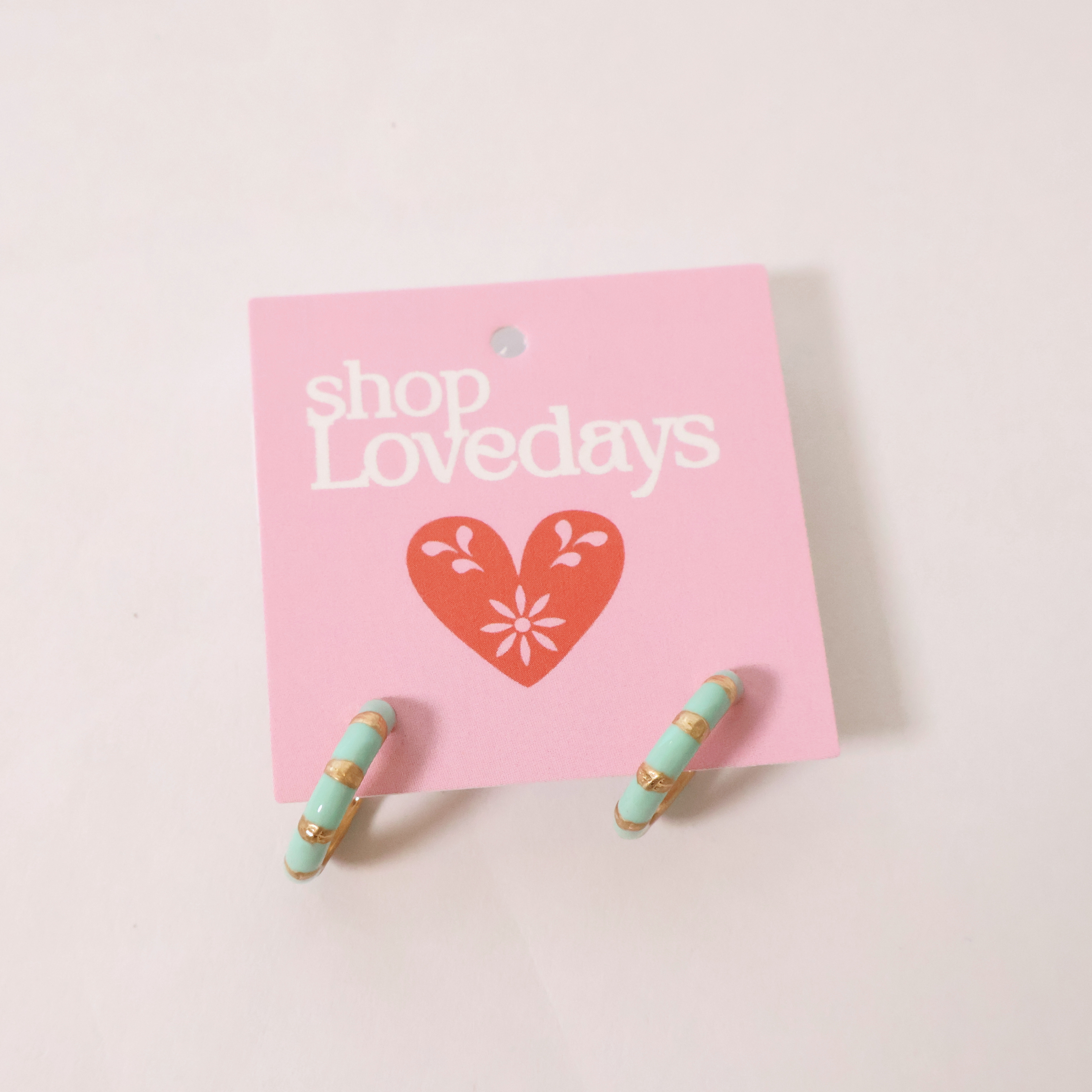 Front view of Junie Mint Green Hoops on a product tag