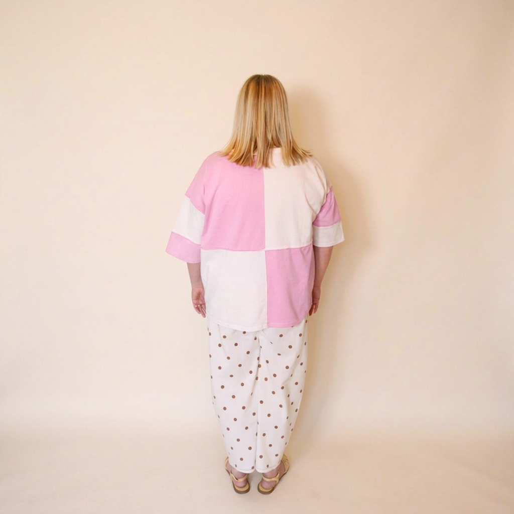 Image of the a woman wearing the Pippa tee and polkadot bonnie pants facing backwards