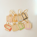 all 8 colors of our Elise Bag Charms shown on a white background