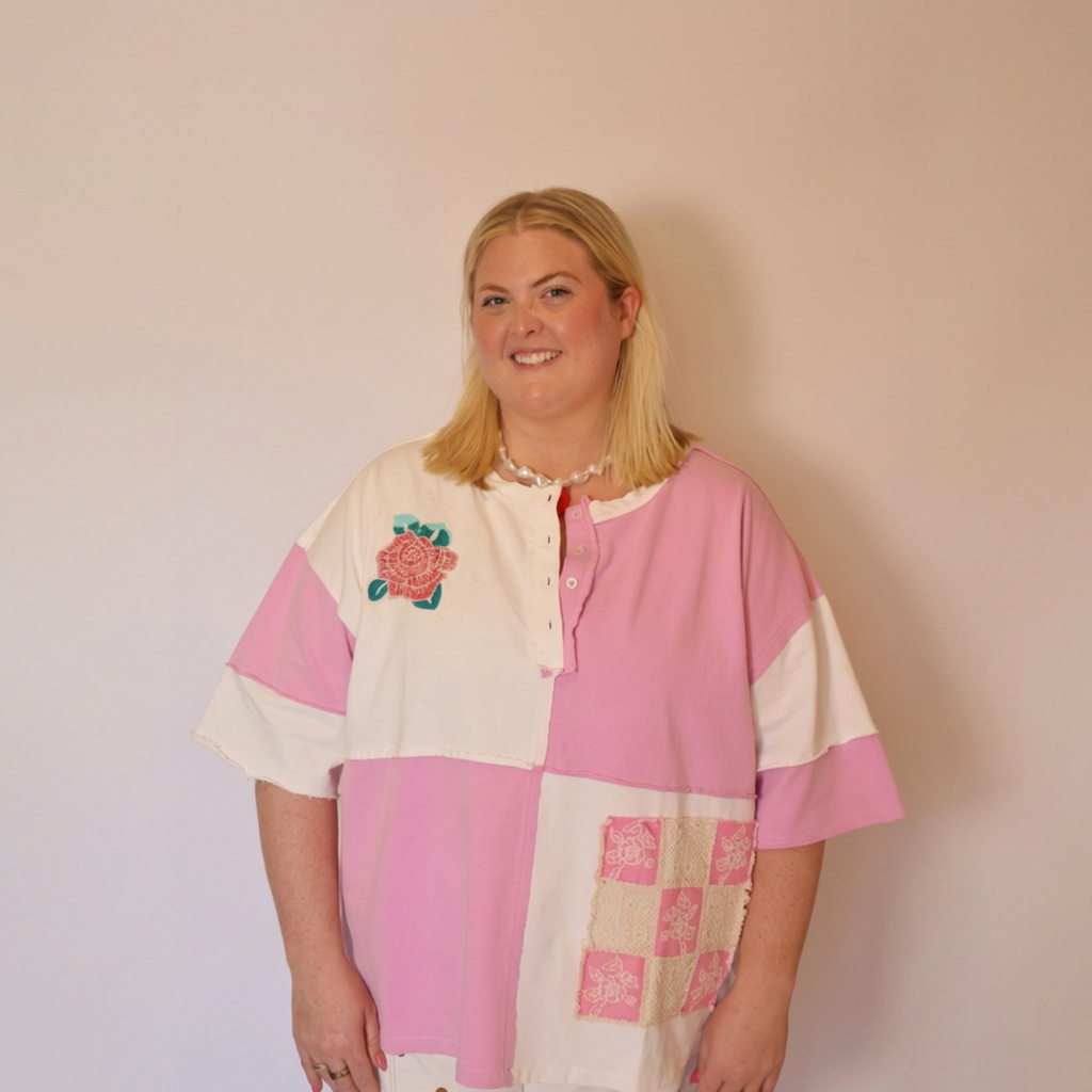 Image of the a woman wearing the Pippa tee facing forward. The image only shows from the waist up.